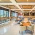 Griya Persada Convention Hotel & Resort Kaliurang lobby lounge in Pakem with tables, bar, and large windows