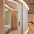 Aerotel Muscat - Airport Transit Hotel in Muscat: modern bathroom and wood-paneled hallway