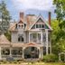 1899 Wright Inn & Carriage House in Asheville, Victorian inn with wraparound porch and lush trees