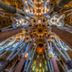 Cuatro Naciones Barcelona interior with ornate vaulted ceiling and colorful stained-glass details