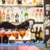 Hotel Villa Hakuba By Hhg bar staff pouring drinks into four glasses in Hakuba