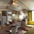 hu I Pini village in Fiano Romano: compact cabin-style room with kitchenette, dining table and twin beds