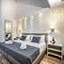 B&B Lorenzo de' Medici Florence guest room with double bed, window seat and modern wall lights