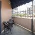 The Quay Hotel Bugis Singapore balcony with two chairs and city view