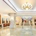 Zhangzhou Yinjia Hotel (Gucheng Branch) lobby with marble floors, chandeliers, and a central staircase in Zhangzhou