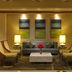 Hilton Grand Vacations Club Parc Soleil Orlando lobby seating area in Orlando with sofa, armchairs and lamps