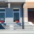 Alexander's in Hastings exterior with blue facade, entrance, windows, and flower boxes