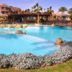 Rehana Sharm Resort in Sharm el-Sheikh with a large lagoon-style pool and palm-lined courtyard