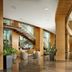 Minsk Marriott Hotel lobby with sweeping wooden staircase, glass railings, and polished floors in Minsk