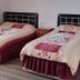 Hotel Baykal in Bogazkale room with two single beds and burgundy bedding