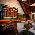 Park Chalet, Shahdag Autograph Collection in Kuzun: stylish lounge with bar, seating, and wood-beam ceiling