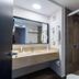 Meson Ejecutivo Guadalajara bathroom with vanity, mirror, and glass walk-in shower