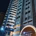 Camboriú Praia Hotel exterior at night in Balneário Camboriú with illuminated facade and entrance