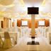 Glory Place Hua Hin banquet hall with rows of covered chairs and tables under draped ceiling lights