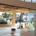 Seven Sky Clarks Exotica, Bhuj lobby with glass entrance and view of parked car outside
