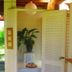 Sans Souci Inn in Pohara: open doorway to a small sitting area with potted plant and hanging lamp