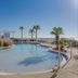Holiday Inn Express Pensacola Beach By IHG rooftop pool with palm trees and ocean views in Pensacola Beach