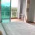 Breeze Hill Resort Khao Kho room with bed and balcony view of trees and hills