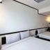 Toyoko Inn Cebu in Mandaue City, twin room with two neatly made beds and a wall-mounted TV