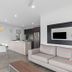 Blue Lake Holiday Park in Mount Gambier: bright open-plan cabin with kitchen, dining area, sofa and lake view