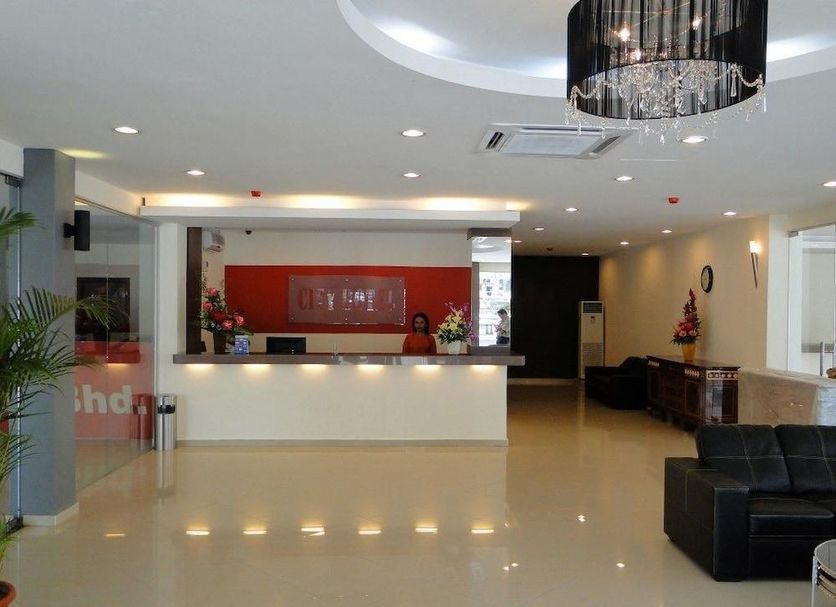 Jb City Hotel lobby in Johor Bahru with front desk and seating area