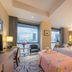 Ziction Liberal Hotel Xi'an guest room with twin beds, city view windows, and desk