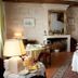 La Demeure Saint-Ours dining room in Loches with set tables, fireplace and exposed beams