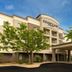 Courtyard by Marriott Pittsburgh Greensburg exterior with covered entrance and trees