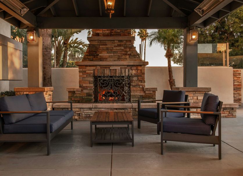 Four Points by Sheraton Los Angeles Westside patio with seating and stone fireplace in Culver City