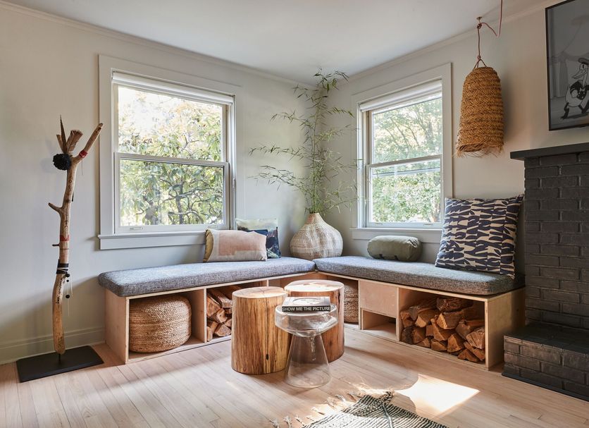 Woodstock Way Hotel in Woodstock: cozy corner window seat, wood log storage, and black fireplace