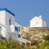 Dolphin Bay Seaside Resort & Suites in Galissas, white-and-blue seaside buildings on a hillside