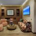 Park Suites Hotel Luxury Boutique Hotel in Casablanca lounge with armchairs, patterned sofa, coffee table and wall TV
