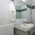 Maistra Apartments Villas Rubin, Rovinj bathroom with sink, wall-mounted hair dryer, and bathtub