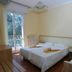 Hotel Atilius Adults Only room in Limone sul Garda with three twin beds and balcony door