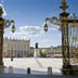 Hotel Les Portes D'Or in Nancy, view through ornate gates of a sunlit city square and monument