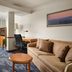 Fairfield Inn & Suites by Marriott Indianapolis East room with sofa, desk, and workspace in Indianapolis