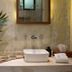 Ya'ax Hotel Boutique in Mérida: stone vanity with vessel sink, wall mirror, and leafy plant