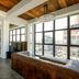 Wythe Hotel, Brooklyn: loft-style suite with leather sofa, large windows, and city view