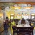 Umaid Mahal - A Heritage Style Boutique Hotel in Jaipur dining hall with ornate carved doorway and stained-glass windows