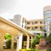 Constellation Hotel in Port Au Prince with curved balconies, arched walkways and a courtyard fountain