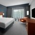 Courtyard by Marriott Pittsburgh Airport Settlers Ridge guest room with king bed and large window in Pittsburgh