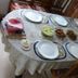 Achayans Homestay Mararikulam dining table set with plates, bowls, and assorted served dishes in Alappuzha