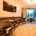 City Hotel Mercator in Frankfurt am Main lounge with city view, seating area, wall art and round rug