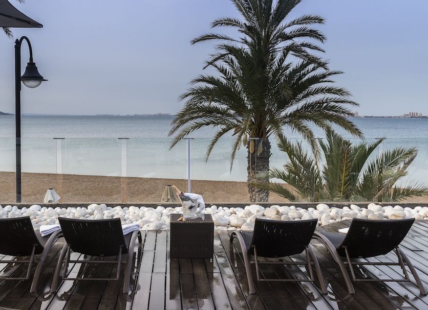 El Secreto Del Agua in Mar de Cristal: beachfront terrace with palm trees, lounge chairs and sea view
