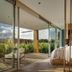 Hotel Entre Cielos in Luján de Cuyo bedroom with floor-to-ceiling glass and vineyard views