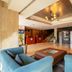 Royal Orchid Central Jaipur lobby with blue seating, reception desk, and staircase in Bani Park