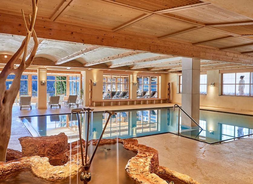 Sporthotel Panorama in Corvara in Badia features an indoor pool and spa with wood-beam ceilings