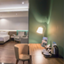 Geary Hotel Bandung room with bed, chair, desk lamp and coffee setup in Bandung