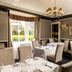 Loch Ness Country House Hotel in Inverness dining room with set tables and bay window