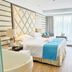 1881 Peninsula Hotel in Wuxi guest room with king bed, bathtub, and floor-to-ceiling window